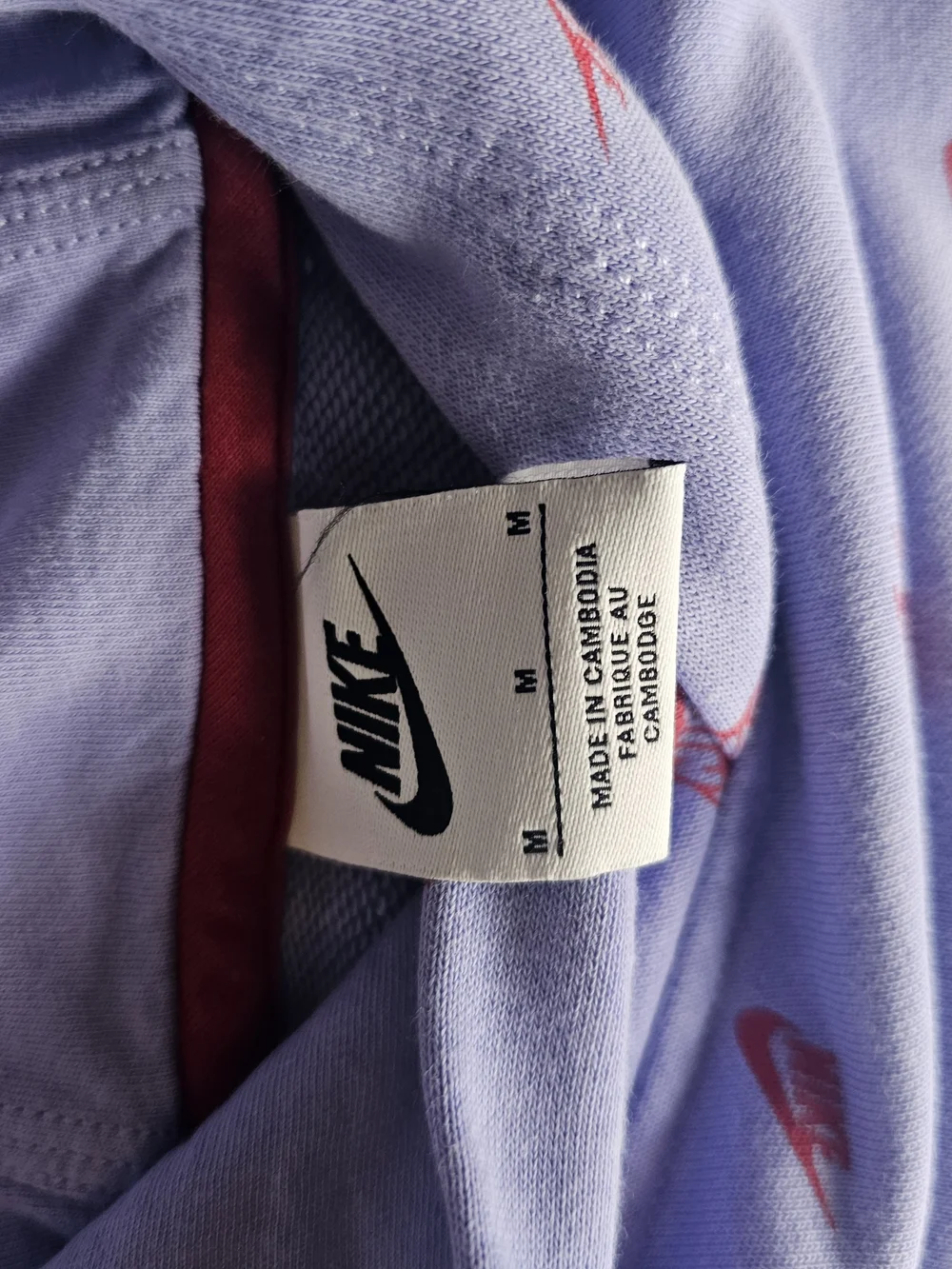 Girls Nike Lilac Hoodie with Red Swoosh Pattern